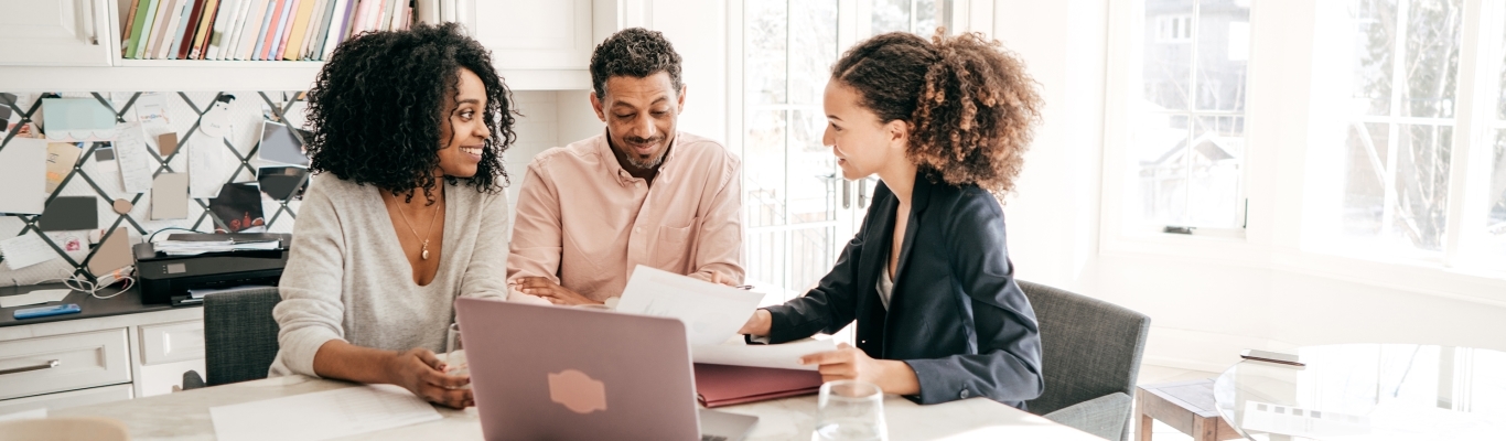 Woman Advisor Meeting with Clients in Their Home